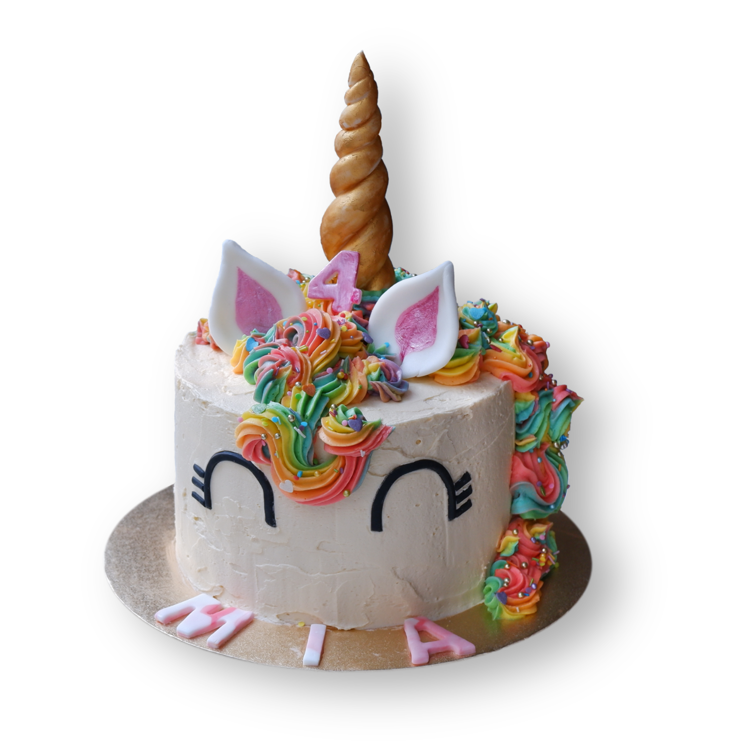 Unicorn cake, with gold horn, rainbow mane and sprinkles everywhere